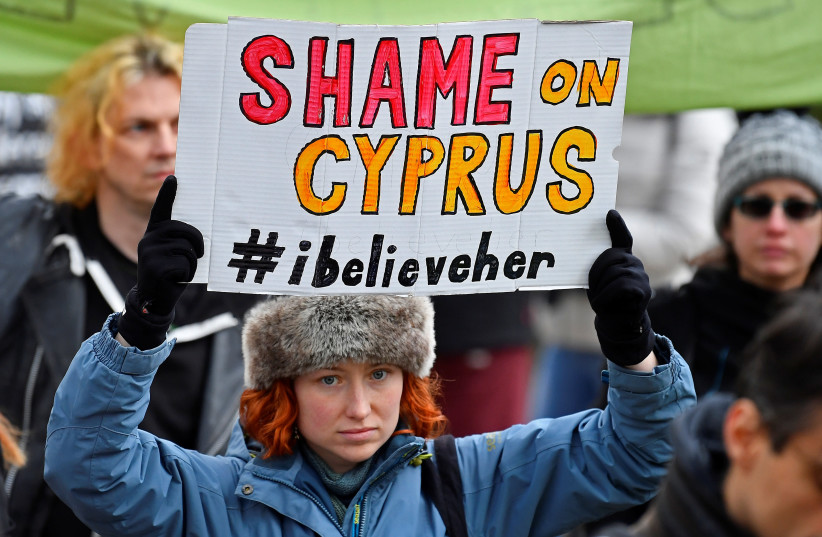 Protestors supporting a British woman found guilty of lying in a rape case in Cyprus, take part in a march in London, Britain, January 6, 2020. (photo credit: REUTERS/TOBY MELVILLE)