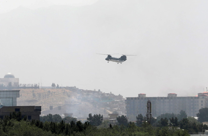  CH-46 Sea Knight military transport helicopter flies over Kabul, Afghanistan (photo credit: REUTERS/STRINGER)