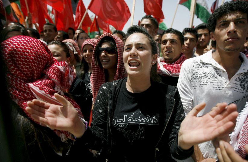 Palestinian students take part in an elections campaign for the Student Council at the Birzeit University campus in the West Bank city of Ramallah April 21, 2008.  (photo credit: FADI AROURI/REUTERS)