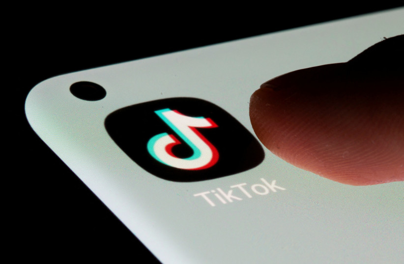  TikTok app is seen on a smartphone in this illustration taken, July 13, 2021.  (photo credit: REUTERS/DADO RUVIC)