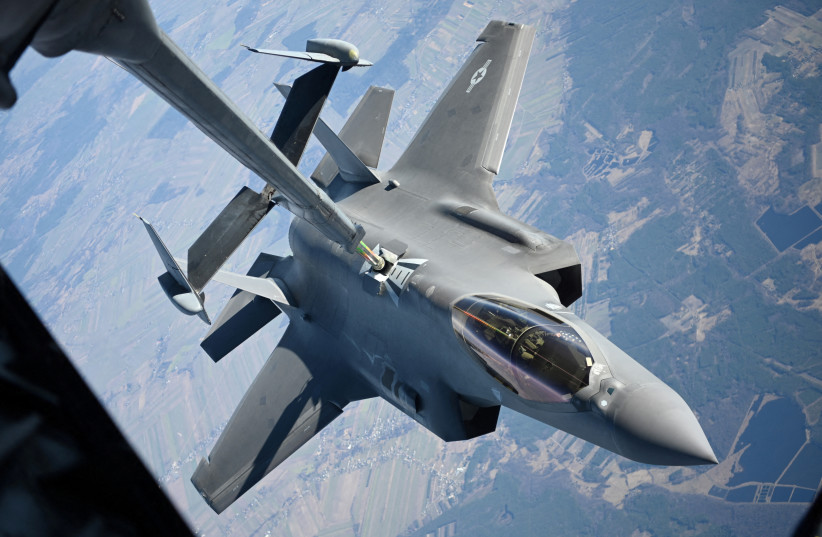  A US Air Force F-35 Lightning II aircraft assigned to the 34th Fighter Squadron receives fuel from a KC-10 Extender aircraft over Poland, February 24, 2022. (photo credit: US Air Force/Senior Airman Joseph Barron/Handout via REUTERS)