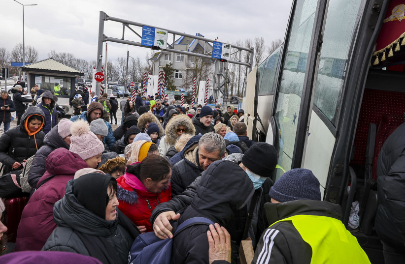  Ukrainian fleeing war zones in  Ukraine are seen at the Romanian-Ukrainian border, in Palanca Moldova, on  March 3, 2022. (photo credit: NATI SHOHAT/FLASH90)