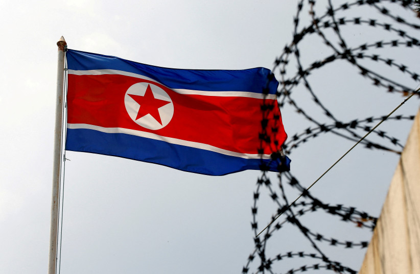  A North Korea flag flutters next to concertina wire at the North Korean embassy in Kuala Lumpur, Malaysia March 9, 2017. (photo credit: EDGAR SU/ REUTERS)