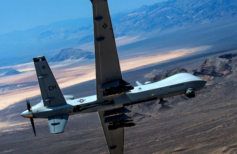 An MQ-9 Reaper remotely piloted drone aircraft performs aerial maneuvers over Creech Air Force Base, Nevada, US, June 25, 2015. (photo credit: US AIR FORCE/SENIOR AIRMAN CORY D. PAYNE/HANDOUT VIA REUTERS)