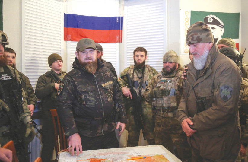  HEAD OF the Chechen Republic Ramzan Kadyrov (center) meets with Russian commanders at an operations center in Mariupol last month.  (photo credit: REUTERS/CHINGIS KONDAROV)
