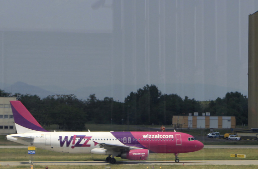 Wizz Air's aircraft is seen on the tarmac at Budapest Airport, May 22, 2014. (photo credit: REUTERS/BERNADETT SZABO)