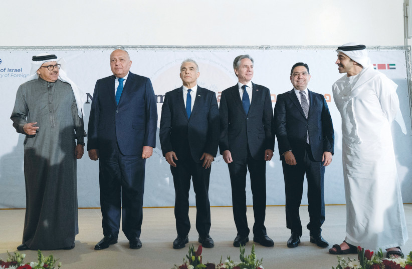  THE FOREIGN MINISTERS of Israel, Bahrain, Egypt, Morocco and UAE, along with US Secretary of State Antony Blinken, talk while posing for a photo at the Negev Summit last month. A regional security axis with US backing is a realistic option. (photo credit: Jacquelyn Martin/Reuters)