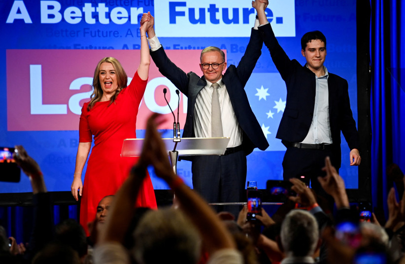  Anthony Albanese, leader of Australia's Labor Party is accompanied by his partner Jodie Haydon and son Nathan Albanese while he addresses his supporters after incumbent Prime Minister and Liberal Party leader Scott Morrison conceded defeat in the country's general election, in Sydney, Australia. (photo credit: REUTERS/JAIMI JOY)