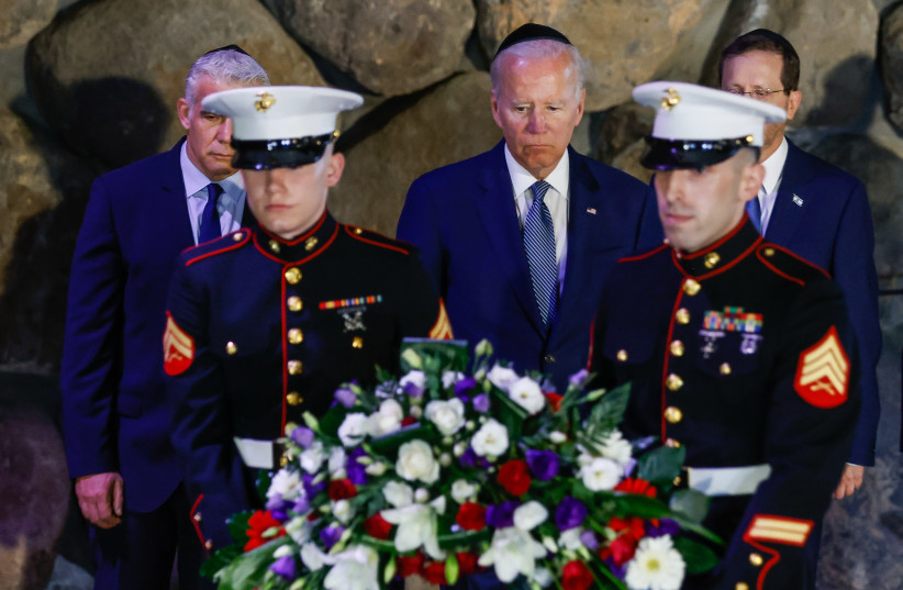  US president Joe Biden, Prime Minister Yair Lapid, Israeli president Isaac Herzog and Minister of Defense Benny Gantz visit at the Yad Vashem Holocaust memorial in Jerusalem on July 13, 2022 (photo credit: OLIVIER FITOUSSI/FLASH90)