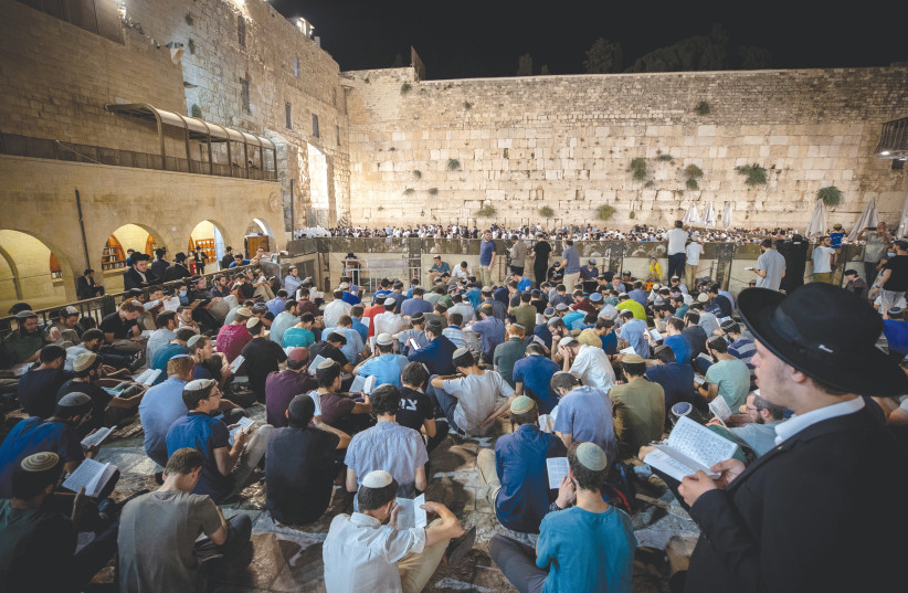  PRAYERS TAKE place at the Western Wall on Tisha Be’av, last year.  (photo credit: YONATAN SINDEL/FLASH90)