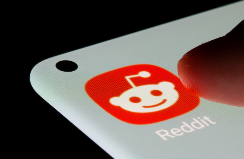  Reddit app is seen on a smartphone in this illustration taken, July 13, 2021.  (photo credit: REUTERS/DADO RUVIC/ILLUSTRATION)
