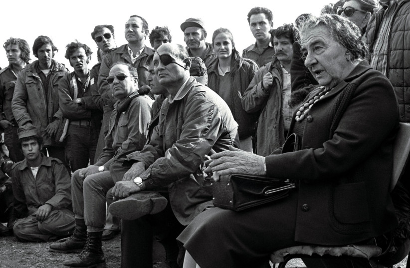  Prime minister Golda Meir, accompanied by her defense minister Moshe Dayan, meets with soldiers on the Golan Heights after the 1973 Yom Kippur War.  (photo credit: REUTERS)