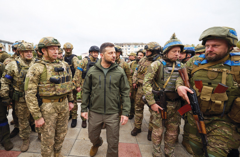 UKRAINE’S PRESIDENT Volodymyr Zelensky walks with soldiers in the town of Izium after it was liberated by Ukraine’s armed forces. (photo credit: Ukrainian Presidential Press Service)