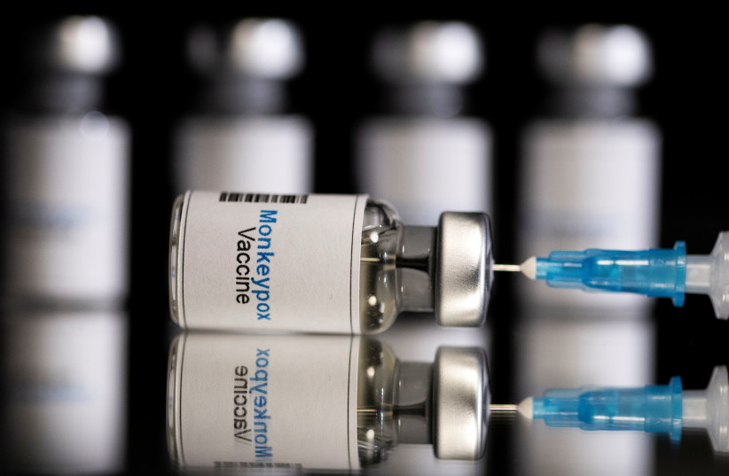  Mock-up vials labeled "Monkeypox vaccine" and medical syringe are seen in this illustration taken, May 25, 2022.  (photo credit: REUTERS/DADO RUVIC/ILLUSTRATION)