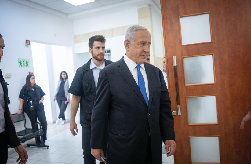  BENJAMIN NETANYAHU arrives at the Jerusalem District Court for a hearing in his trial, in May. The writer asks: What will Netanyahu need to concede in exchange for his get-out-of-jail-free card? (photo credit: YONATAN SINDEL/FLASH90)