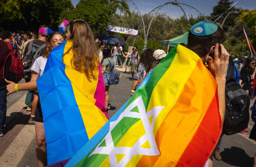  People take part in a rally marking the annual Gay Pride Parade in Jerusalem, on June 3, 2021.  (photo credit: OLIVIER FITOUSSI/FLASH90)