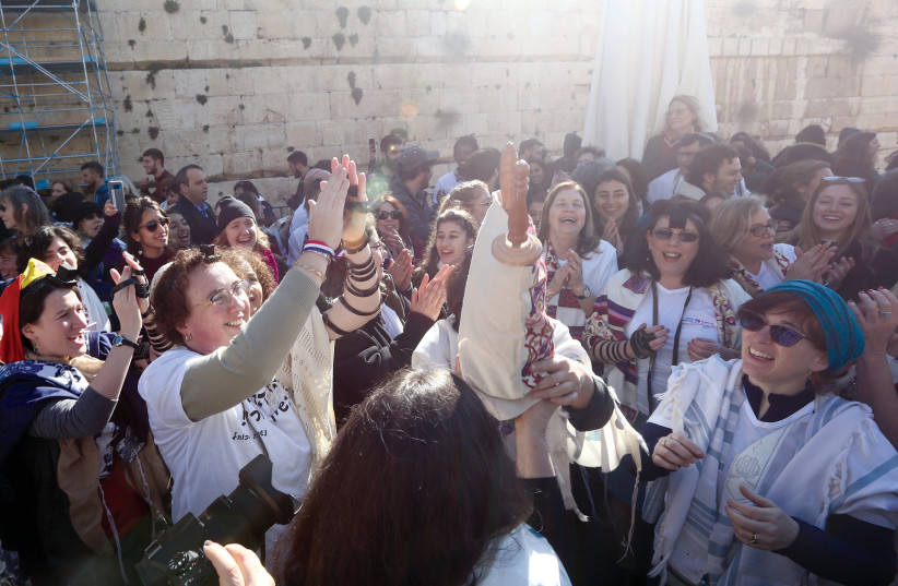  Women of the Wall celebrate after regrouping at the Egalitarian Section of the Western Wall in 2019. (photo credit: MARC ISRAEL SELLEM)