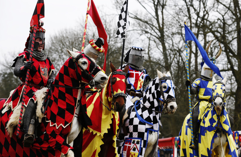  Performers dressed as medieval knights prepare to joust at Knebworth House in Hertfordshire (photo credit: REUTERS)