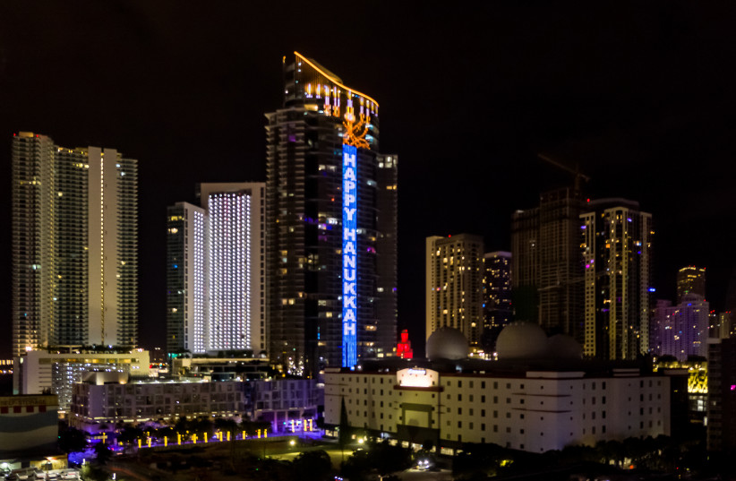  The World’s Tallest Electronic Menorah lights-up the South Florida skyline at the 60-story, 700-foot-tall, ultra-futuristic Paramount Miami Worldcenter skyscraper in downtown Miami. (photo credit: Bryan Glazer | World Satellite Television News)