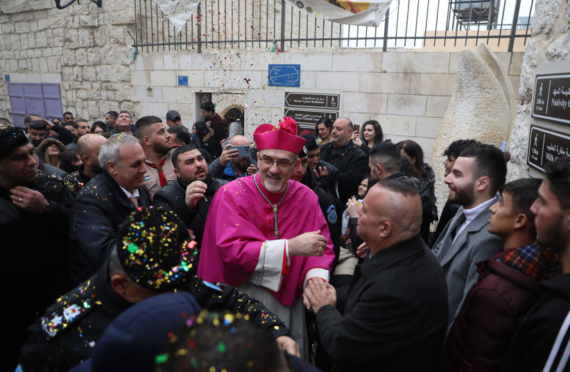  The Latin Patriarch of Jerusalem Pierbattista Pizzaballa arrives to the Church of the Nativity in the West Bank city of Bethlehem, on the eve of the Christmas holiday December 24, 2022. (photo credit: WISAM HASHLAMOUN/FLASH90)