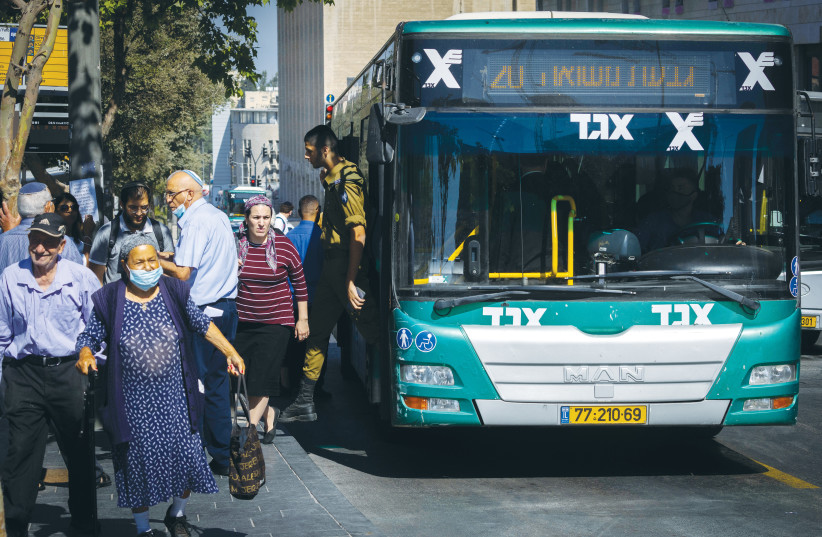  A BUS STOPS outside the Central Bus Station in Jerusalem.  (photo credit: OLIVIER FITOUSSI/FLASH90)