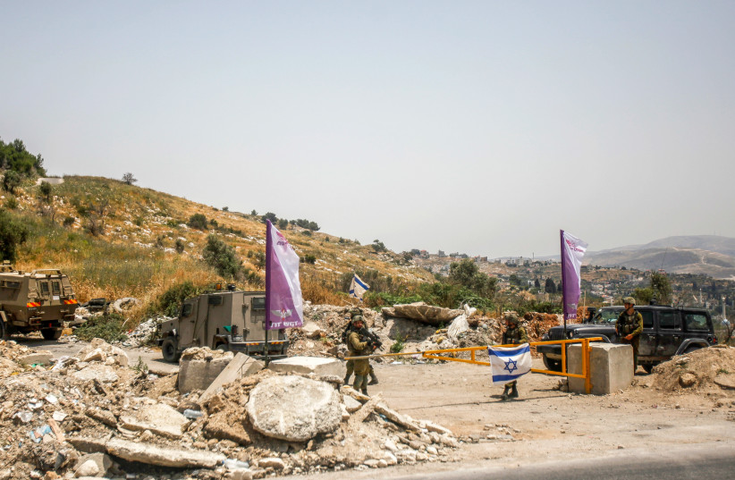 Israeli soldiers block the entrance to Homesh in the West Bank on May 28, 2022. (photo credit: NASSER ISHTAYEH/FLASH90)