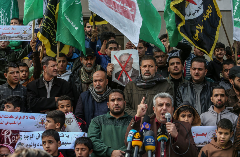  Hamas and Islamic Jihad supporters protest in solidarity with Al-Aqsa Mosque, in Radah, in the southern Gaza Strip, on January 6, 2023. (photo credit: ABED RAHIM KHATIB/FLASH90)
