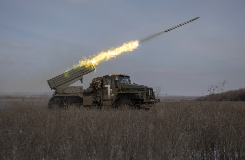  Ukrainian servicemen fire a BM-21 Grad multiple launch rocket system towards Russian positions on a frontline near the town of Marinka, amid Russia's attack on Ukraine, in Donetsk region, Ukraine, February 7, 2023. (photo credit: MARKO DJURICA/REUTERS)