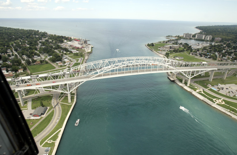 The Bluewater bridge is seen, joining the US (L) and Sarnia, Canada, from a US Customs and Border Protection Blackhawk helicopter in Port Huron, Michigan, August 6, 2008. (photo credit: REUTERS/REBECCA COOK)