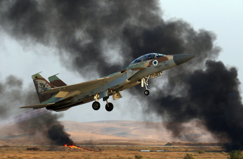 Israel Air Force F-15i Ra'am fly at a Graduation ceremony for Israeli Air Force soldiers who have completed the IAF Flight Course, at the Hatzerim Air Base in the Negev desert. June 28, 2016.  (photo credit: Ofer Zidon /Flash90.)