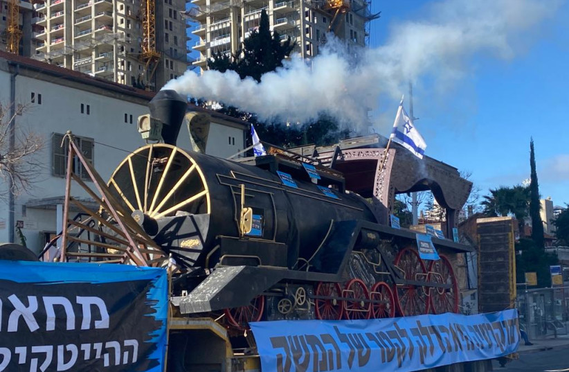  High-tech workers with a massive locomotive train protest against the judicial reforms in central Tel Aviv on March 9, 2023. (photo credit: AVSHALOM SASSONI/MAARIV)