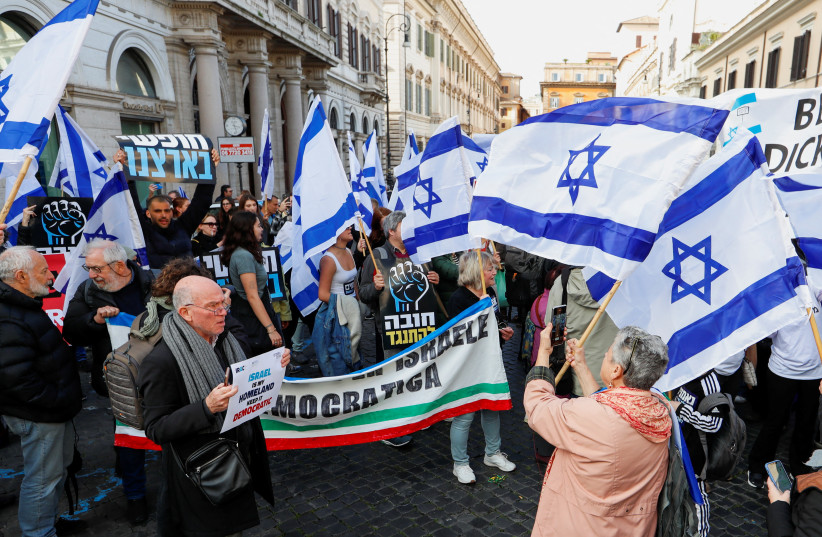  Italians and members of the Israeli community attend a protest against Israeli government's proposed judicial reform during the visit of Israeli Prime Minister Benjamin Netanyahu, in Rome, Italy March 10, 2023. (photo credit: REMO CASSILI/REUTERS)