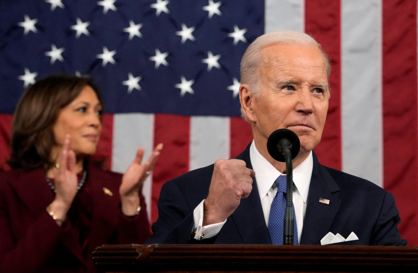 President Joe Biden delivers the State of the Union address to a joint session of Congress at the Capitol, Tuesday, Feb. 7, 2023, in Washington, as Vice President Kamala Harris applauds. (photo credit: Jacquelyn Martin/Pool via REUTERS)