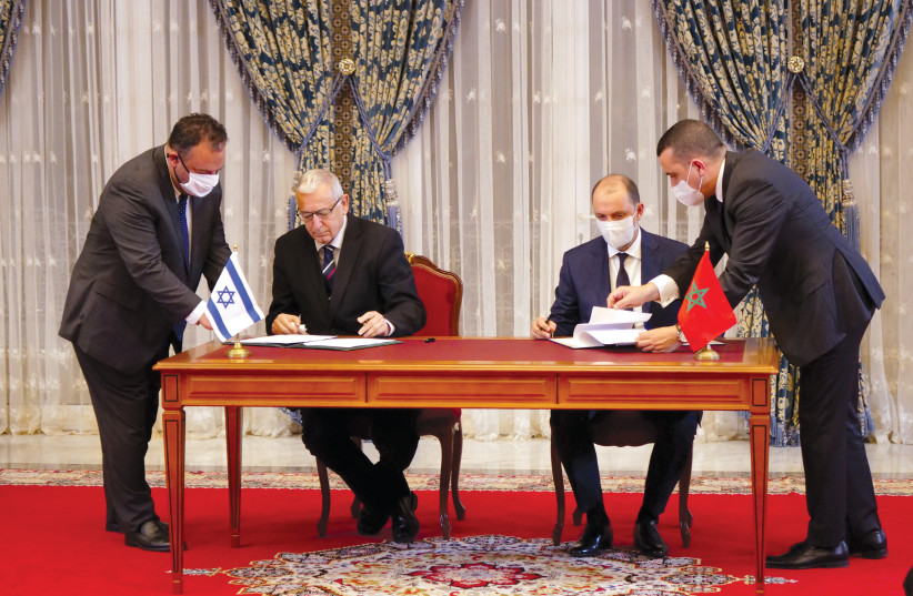  Moroccan and Israeli officials sign memorandums of understanding in Rabat on December 22, 2020.  (photo credit: SHEREEN TALAAT/REUTERS)