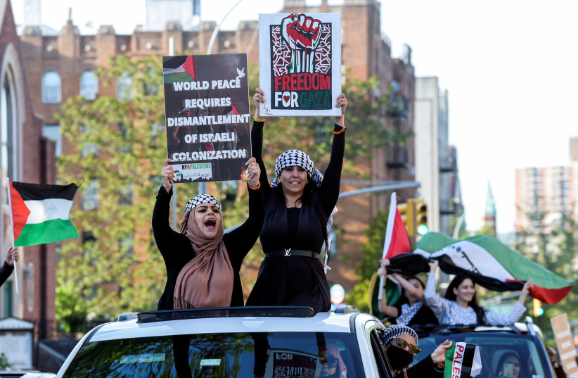 Palestinians and pro-Palestinian supporters protest against Israeli attacks on Gaza amid days of conflict between the two sides, in Brooklyn, New York, U.S., May 15, 2021 (photo credit:  REUTERS/Rashid Umar Abbasi)