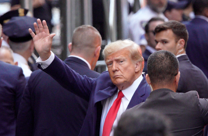  Former US President Donald Trump arrives at Manhattan Criminal Courthouse, after his indictment by a Manhattan grand jury following a probe into hush money paid to porn star Stormy Daniels, in New York City, US, April 4, 2023.  (photo credit: REUTERS/EDUARDO MUNOZ)