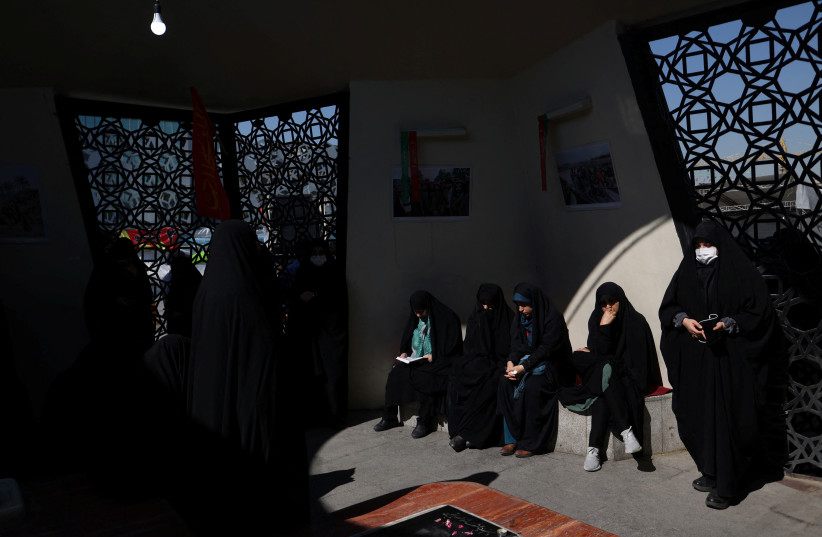  Iranian women gather during the funeral ceremony of Milad Heydari and Meghdad Mahghani, members of Iran's Islamic Revolution Guards Corps (IRGC) who were killed in an Israeli airstrike on Damascus, held in Tehran, Iran, April 4, 2023. (photo credit: Majid Asgaripour/WANA/via Reuters)