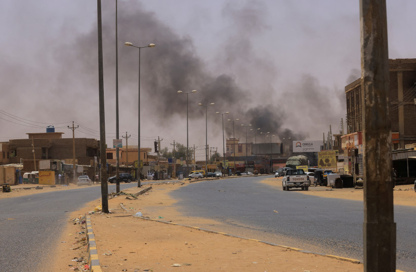  Smoke rises in Omdurman, near Halfaya Bridge, during clashes between the Paramilitary Rapid Support Forces and the army as seen from Khartoum North, Sudan April 15, 2023. (photo credit: REUTERS/MOHAMED NURELDIN ABDALLAH)