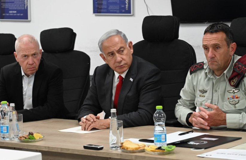  Israeli Prime Minister Benjamin Netanyahu sits between Defense Minister Yoav Gallant (L) and IDF Chief of Staff Lt.-Gen. Herzi Halevi in a situational assessment following rockets fired from Gaza, on May 2, 2023. (photo credit: HAIM ZACH/GPO)