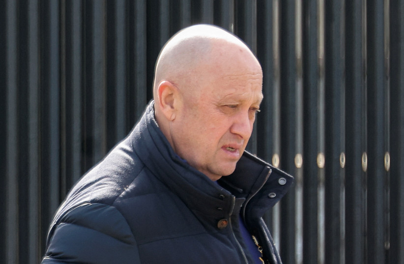  Founder of Wagner private mercenary group Yevgeny Prigozhin leaves a cemetery before the funeral of Russian military blogger Maxim Fomin widely known by the name of Vladlen Tatarsky, who was recently killed in a bomb attack in a St Petersburg cafe, in Moscow, Russia, April 8, 2023.  (photo credit: REUTERS/Yulia Morozova)