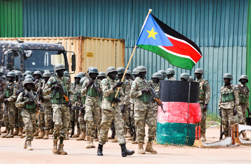  Members of South Sudan People's Defence Forces (SSPDF), part of the troops of the East Africa Community Regional Force (EACRF), parade before departing on their deployment as part of a regional military operation targeting rebels, at the Juba International Airport in Juba, South Sudan April 3, 2023 (photo credit: REUTERS/Samir Bol)