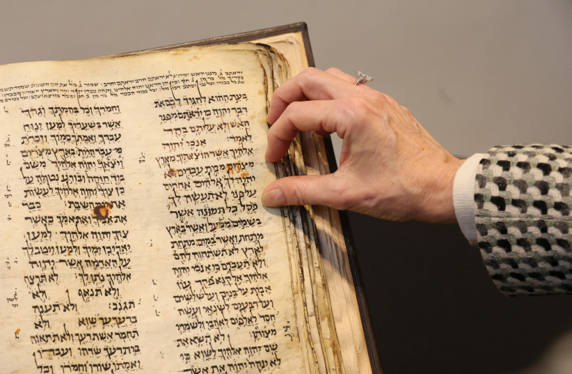  The Codex Sassoon, the earliest and most complete Hebrew Bible ever discovered which is estimated to sell for between $30 million and $50 million, is displayed at Sotheby's in New York City, New York US, February 15, 2023. (photo credit: REUTERS/BRENDAN MCDERMID)