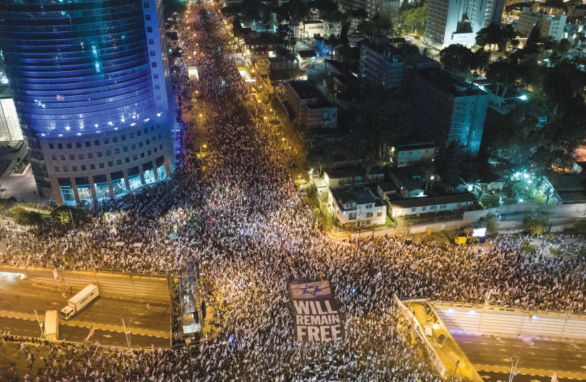 An aerial view shows people demonstrating against the government’s judicial overhaul plans in Tel Aviv on April 15, 2023.  (photo credit: ILAN ROSENBERG/REUTERS)
