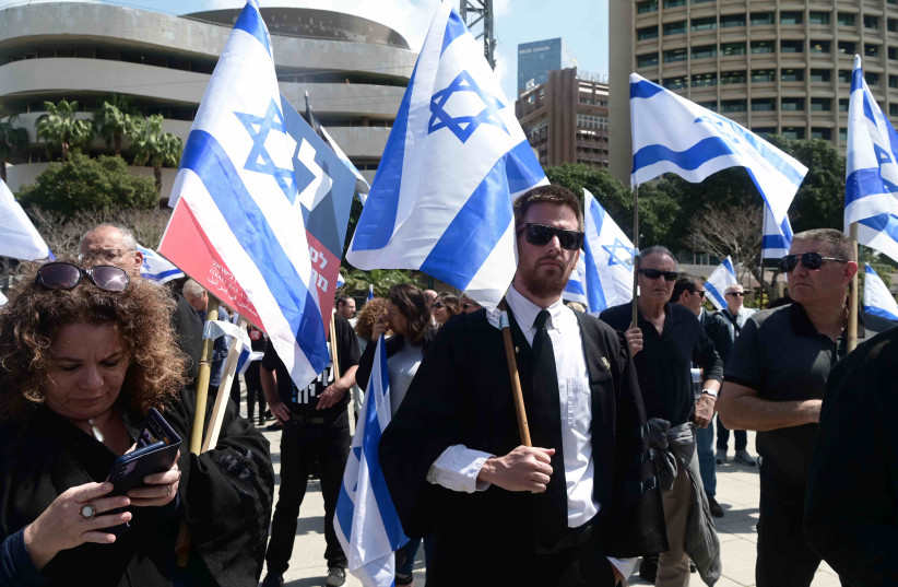  Some 150 lawyers protest in Tel Aviv against the government’s plan to remove Israel Bar Association members from the committee to appoint judges. (photo credit: AVSHALOM SASSONI)