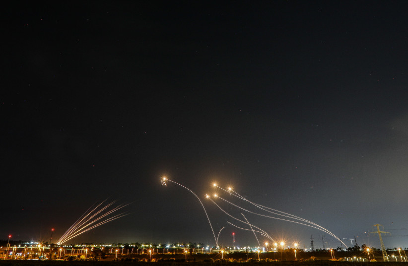  Iron dome anti-missile system fires interception missiles as rockets are fired from the Gaza Strip to Israel, as it seen from Sderot on May 11, 2023.  (photo credit: FLASH90)