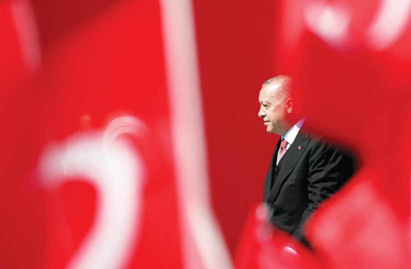  TURKISH PRESIDENT Tayyip Erdogan arrives at an election rally. (photo credit: UMIT BEKTAS/REUTERS)