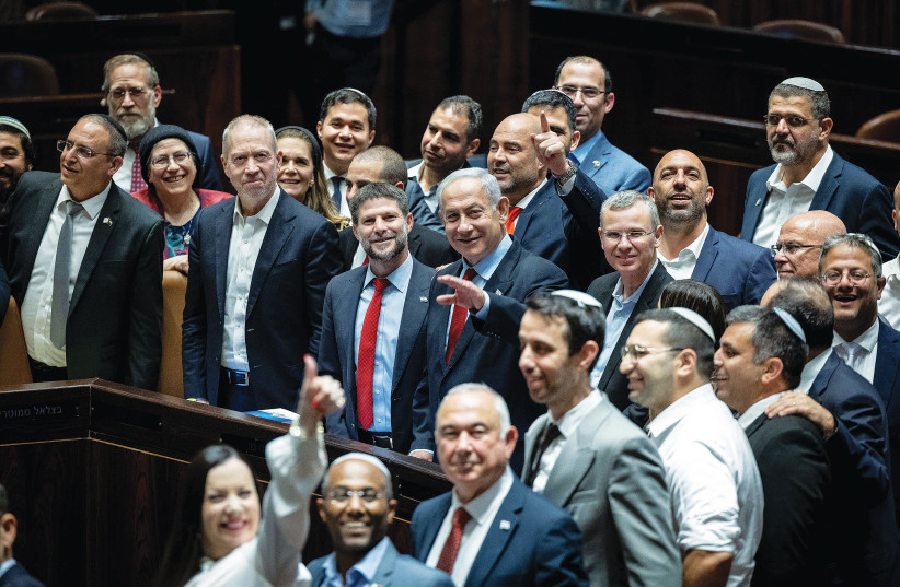 PRIME MINISTER Benjamin Netanyahu and members of his coalition celebrate the passage of the state budget yesterday. (photo credit: YONATAN SINDEL/FLASH90)