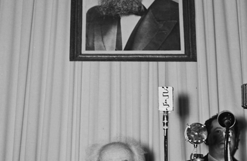  ISRAEL’S FIRST prime minister  David Ben-Gurion sits under a portrait of Theodor Herzl before the reading of the Declaration of Independence in Tel Aviv, May 14, 1948. (photo credit: Frank Scherschel/GPO)