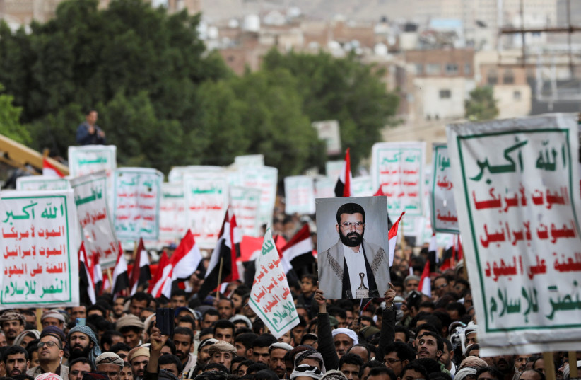  Houthi supporters rally to mark the 8th anniversary of the Saudi-led military intervention in Yemen's conflict, in Sanaa, Yemen March 26, 2023. (photo credit: REUTERS/KHALED ABDULLAH)