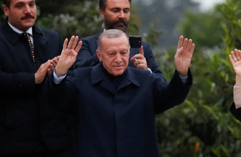 Turkish President Tayyip Erdogan gestures as he addresses his supporters following early exit poll results for the second round of the presidential election in Istanbul, Turkey May 28, 2023. (photo credit: MURAD SEZER/REUTERS)